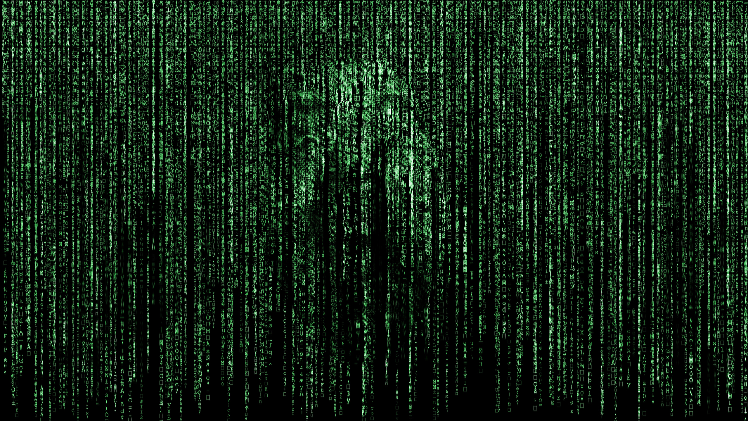 Matrix-like green code with a face emerging.