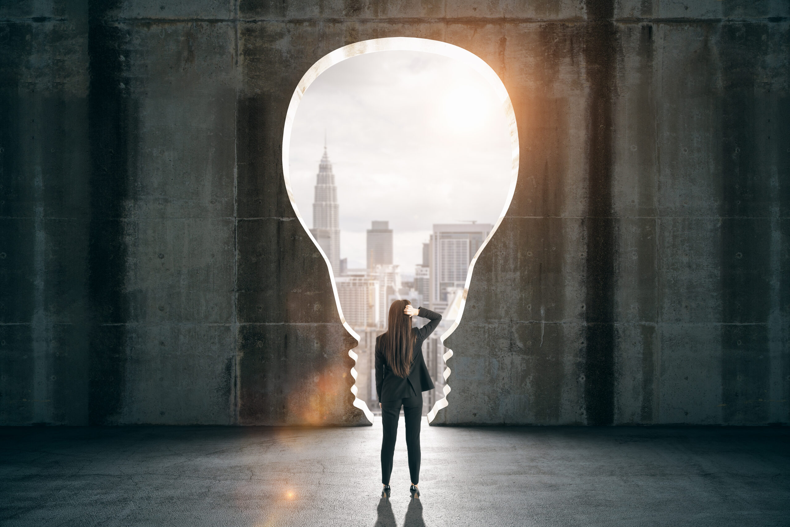 Young businesswoman in abstract black interior with lamp window