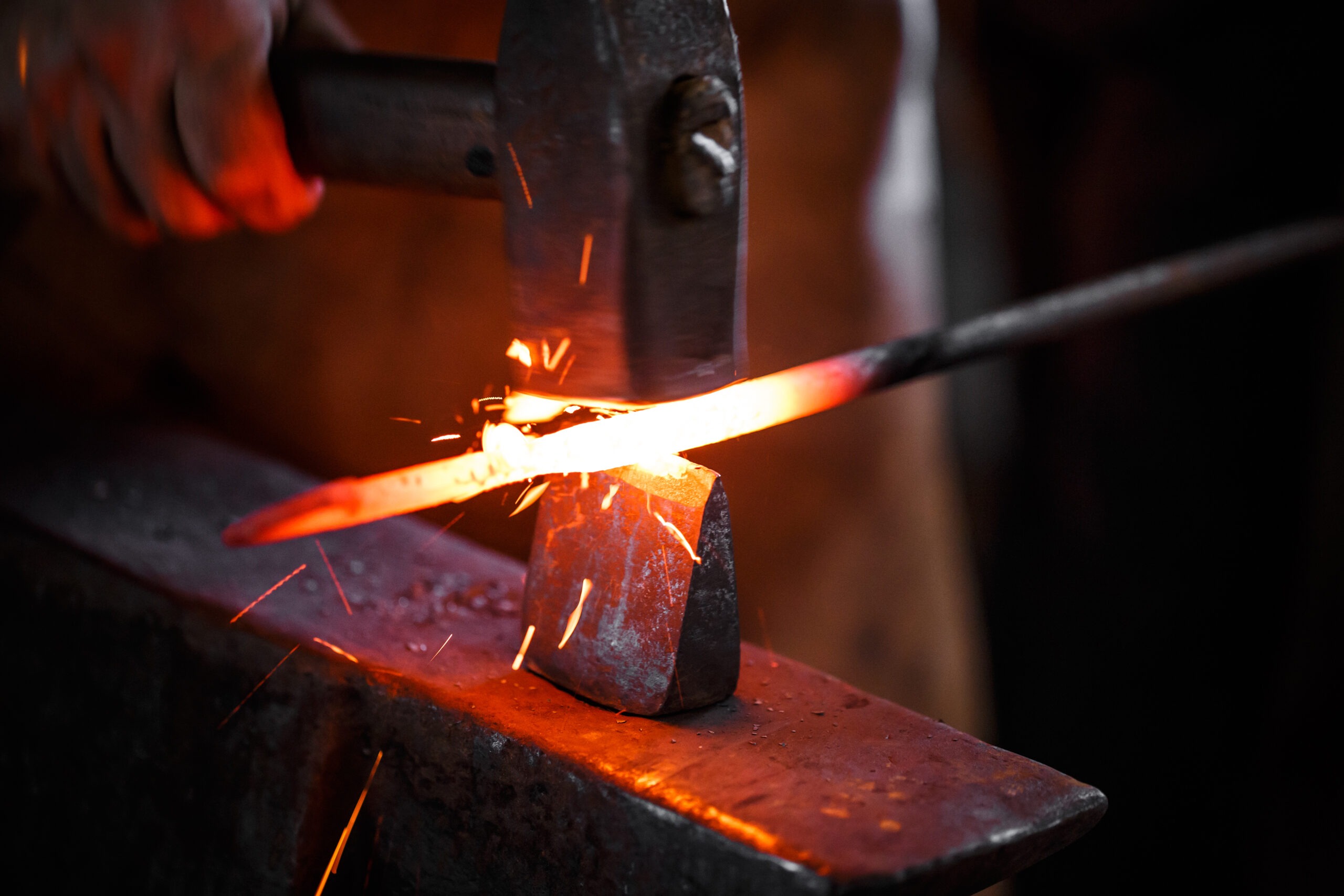The hands of a blacksmith at work in the smithy
