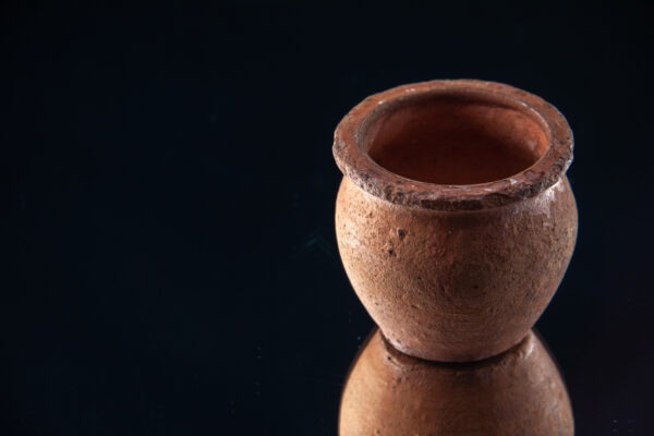 Brown little pot on black background ceramics color darkness plate food meal